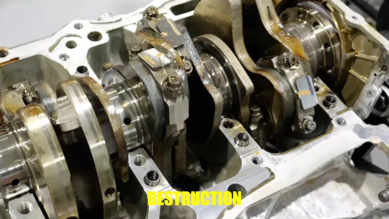 Exposed engine crankshaft and main-bearing supports inside an open engine block