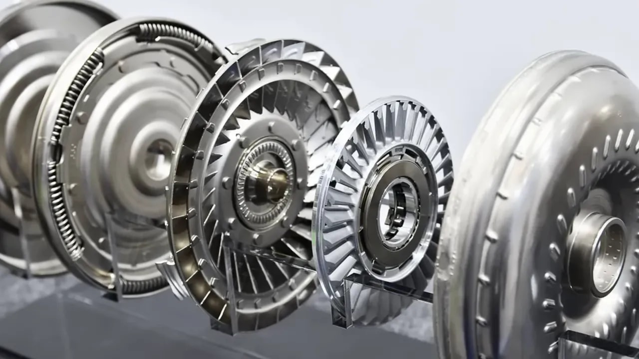 Exploded view of a torque converter showing separated circular housings and bladed components