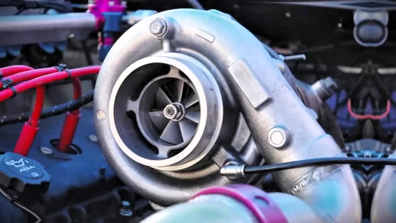 Close-up of a turbocharger housing with the compressor wheel visible